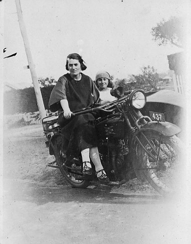 Vera Schultz sitting on a motor bike in 1924