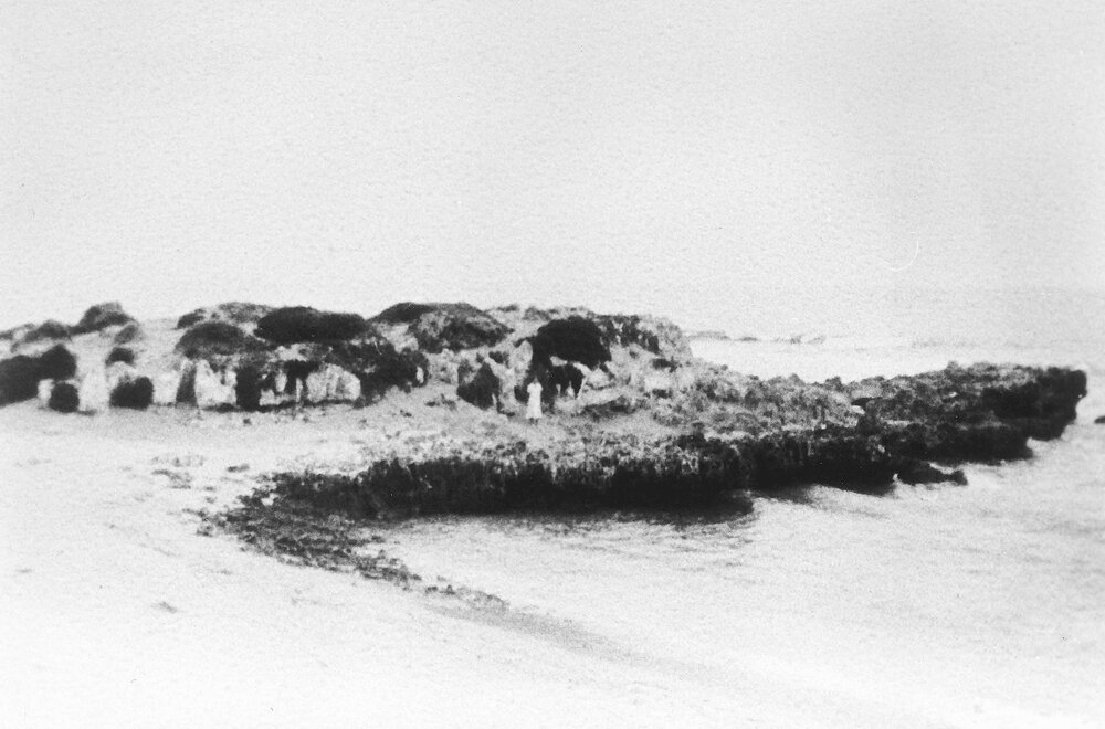Trigg Island with a person standing on the shore
