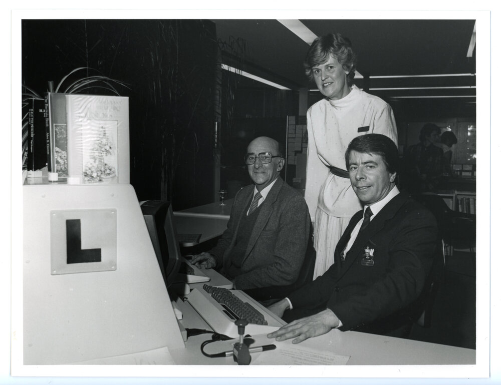 Mr Thomas Hughes (first user to borrow books on the new system) with Kay Poustie and Councillor Terry Tyzack