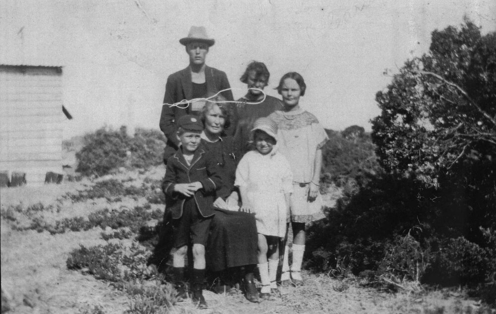 Group of people, outside the North Beach house