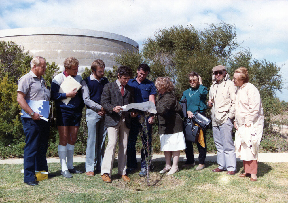 Architect Richard Llorens holding plans during Mount Flora Regional Museum construction