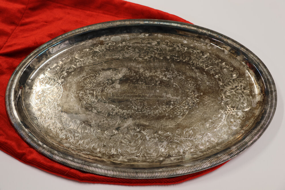 Silver tray and red velvet bag