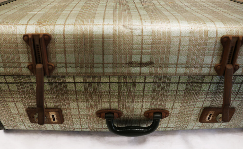 Suitcase with long metal clasps