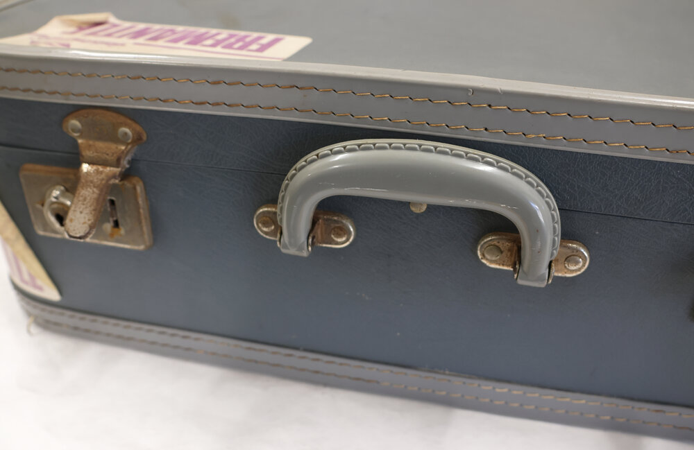 Suitcase blue with labels