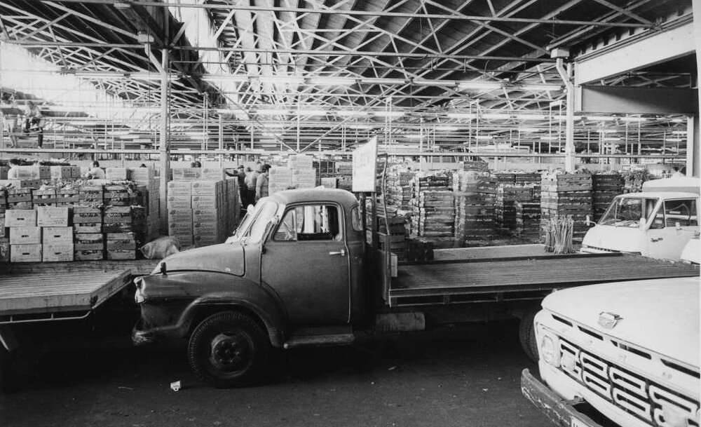 Perth Markets showing crates of produce and vehicles