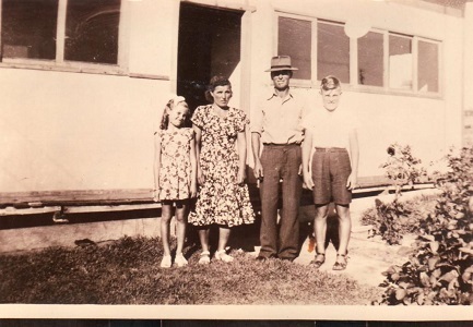 The Vlatko-Rulo family in front of their home 