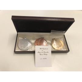 Boxed set of bronze, silver, gold medallions with presentation card