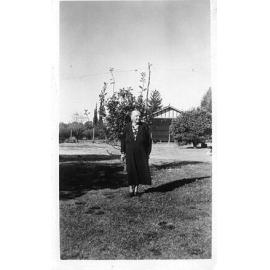 Martha Bond in front of oak tree