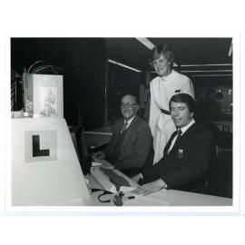 Mr Thomas Hughes (first user to borrow books on the new system) with Kay Poustie and Councillor Terry Tyzack