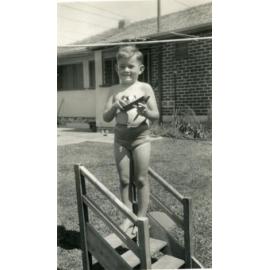 Young boy with his toy boat at his house on Green Street Joondanna