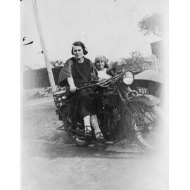 Vera Schultz sitting on a motor bike in 1924