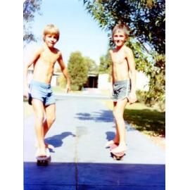 Two boys on skate boards
