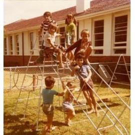 Tuart Hill Primary School students playing on the school play equipment c1985