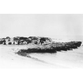 Trigg Island with a person standing on the shore