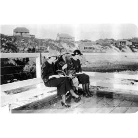 Three ladies sitting on North Beach Jetty c1930