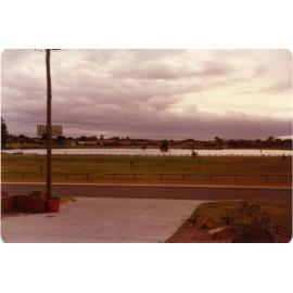 Tamerisk Way looking east to Jackadder Lake with Metro Drive-In in the distance