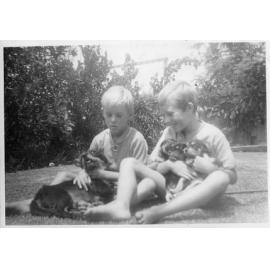 Russell and Jeff with their dog Tina and her puppies