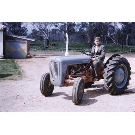 Roger Arbuckle driving a tractor