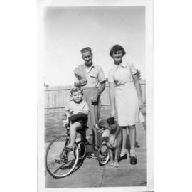 Rae, Laddie the dog, Ronald, and Ronald James at Green Street in Joondanna c1953