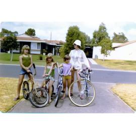 Rae with the kids on bikes