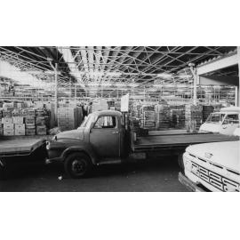Perth Markets showing crates of produce and vehicles