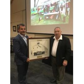 Mayor Mark Irwin accepting a framed photograph donated by the Osborne Park Agricultural Society in 2018