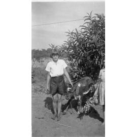 Mavis Schultz with a calf at the family property in Balcatta