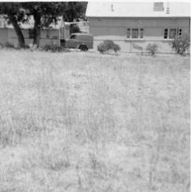 Shed and house with van at the Maddox family property in Balga