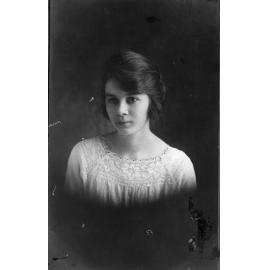 Unknown female Ligman family member against dark background