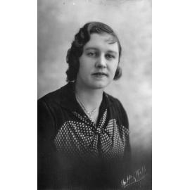 Female Ligman family member with photographer signature across corner