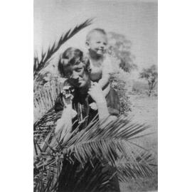 Woman with child on her shoulder, Ligman family at Gwelup