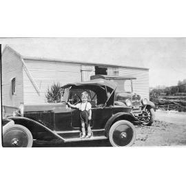 Leslie Schultz standing beside a Citroen car