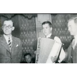 Len Easton as young man playing accordion
