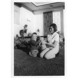 Kyle and Rae holding Nutmeg outside their house 117 Cobb Street in Wembley Downs