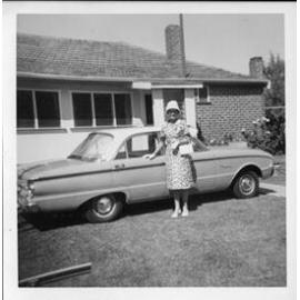 Ivy beside her Falcon parked in front of her house in Joondanna 