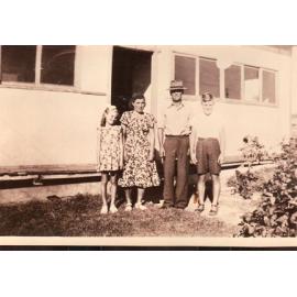 The Vlatko-Rulo family in front of their home 