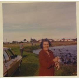 Iole and Alberto Poli feeding the swans at Jackadder Lake in Woodlands