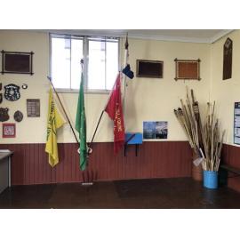 Scout flags inside Weeloc House Scout Hall