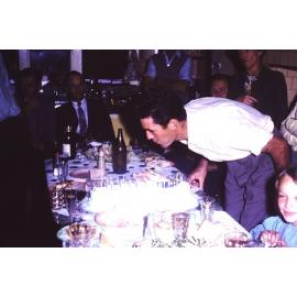 Graeme Arbuckle's blowing the candles on his 21st Birthday cake