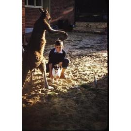 Gerald Kalazich and his pet dog next to a kangaroo in Carine