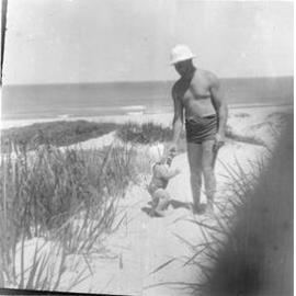 Father and his daughter visiting Brighton Beach in Scarborough 1946