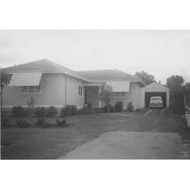Strack family home with car in garage c1960