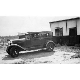 Emil Schultz sitting inside a Whippet sedan in 1936