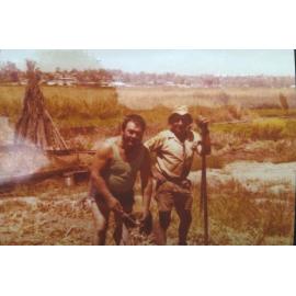 Pasquale D'Ercole working in the garden with his cousin