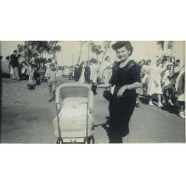 Lady with pram at St Theresa procession and Feast Day, Gwelup