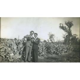 Pasquale D'Ercole sharing a celebratory drink with a fellow countryman