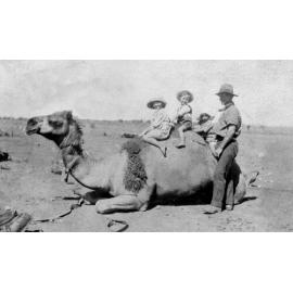 Children riding Bert Pratt's camel in Meekatharra