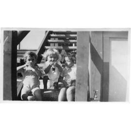 Children enjoying drinks on the stairs of the Paringa Flats, Scarborough 1947