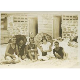 Milner family in front of change rooms at the beach 