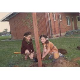 Brownie Guides, Sue-Ellen and Bindi planting a tree at Munro Reserve, Doubleview